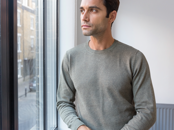 Man in his forties at home in natural morning light.