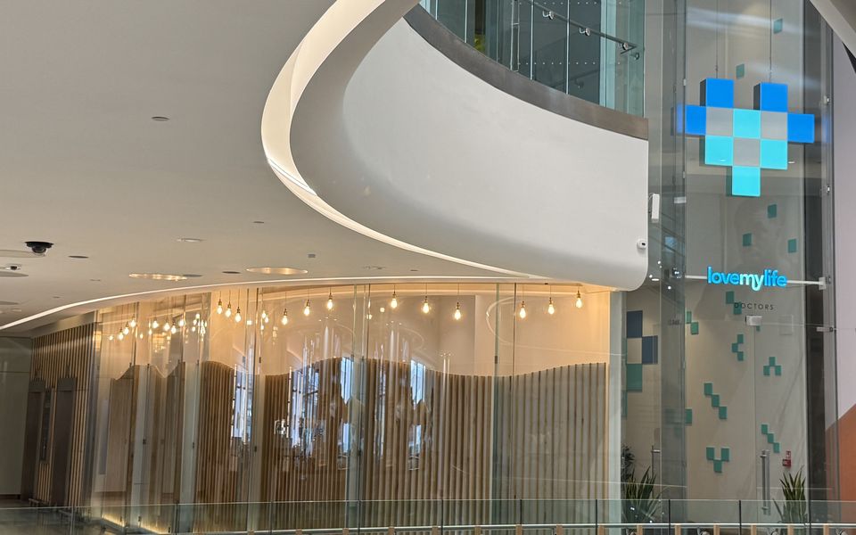 The LoveMyLife clinic frontage at The Village, Westfield London, seen across the upper atrium