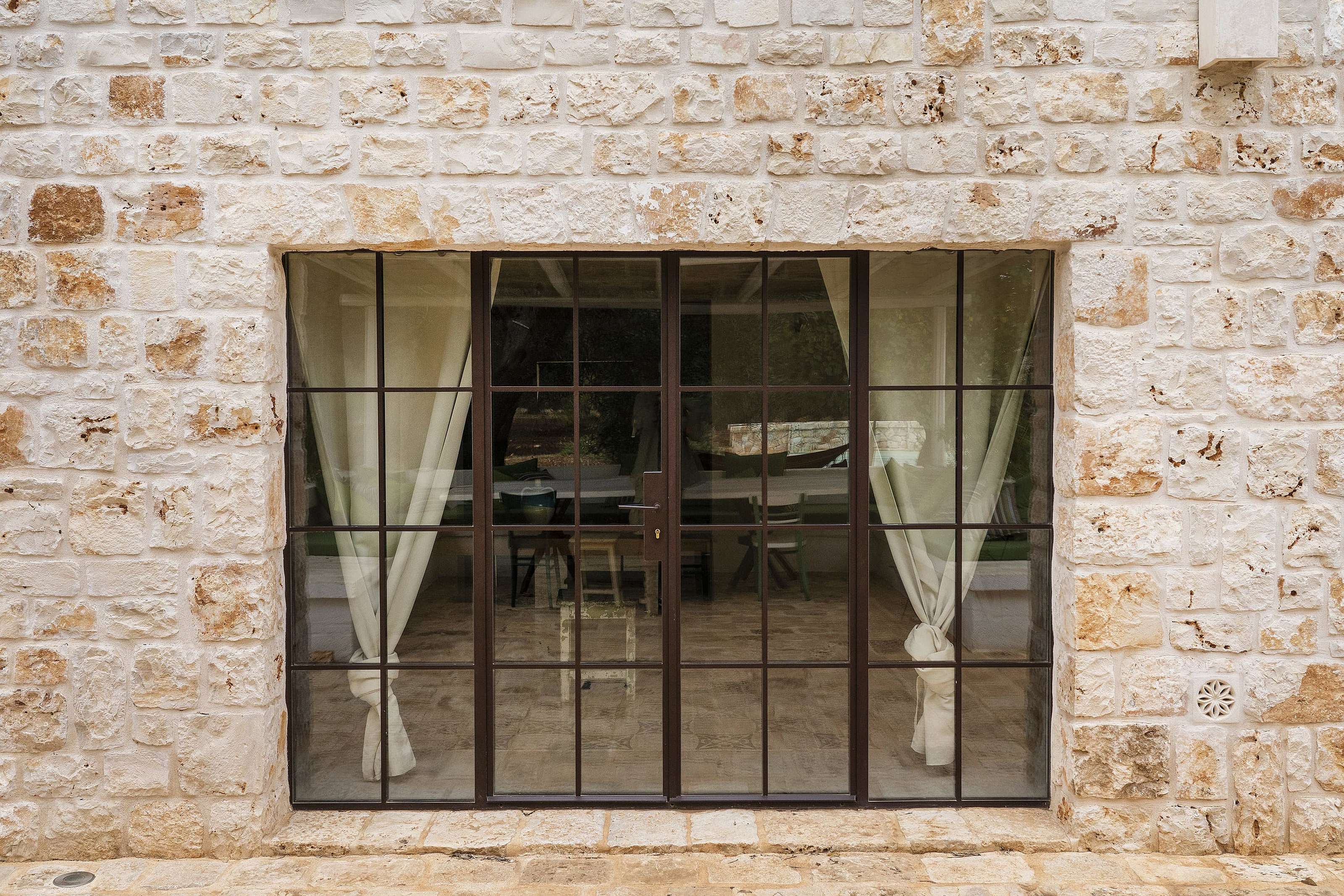A external slimline steel window supplied by Fluid Glass in the UK