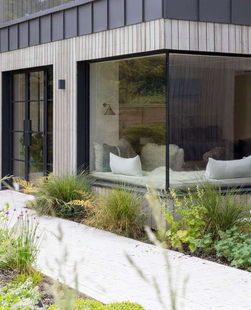 Frameless glass to glass corner window at Orchard House