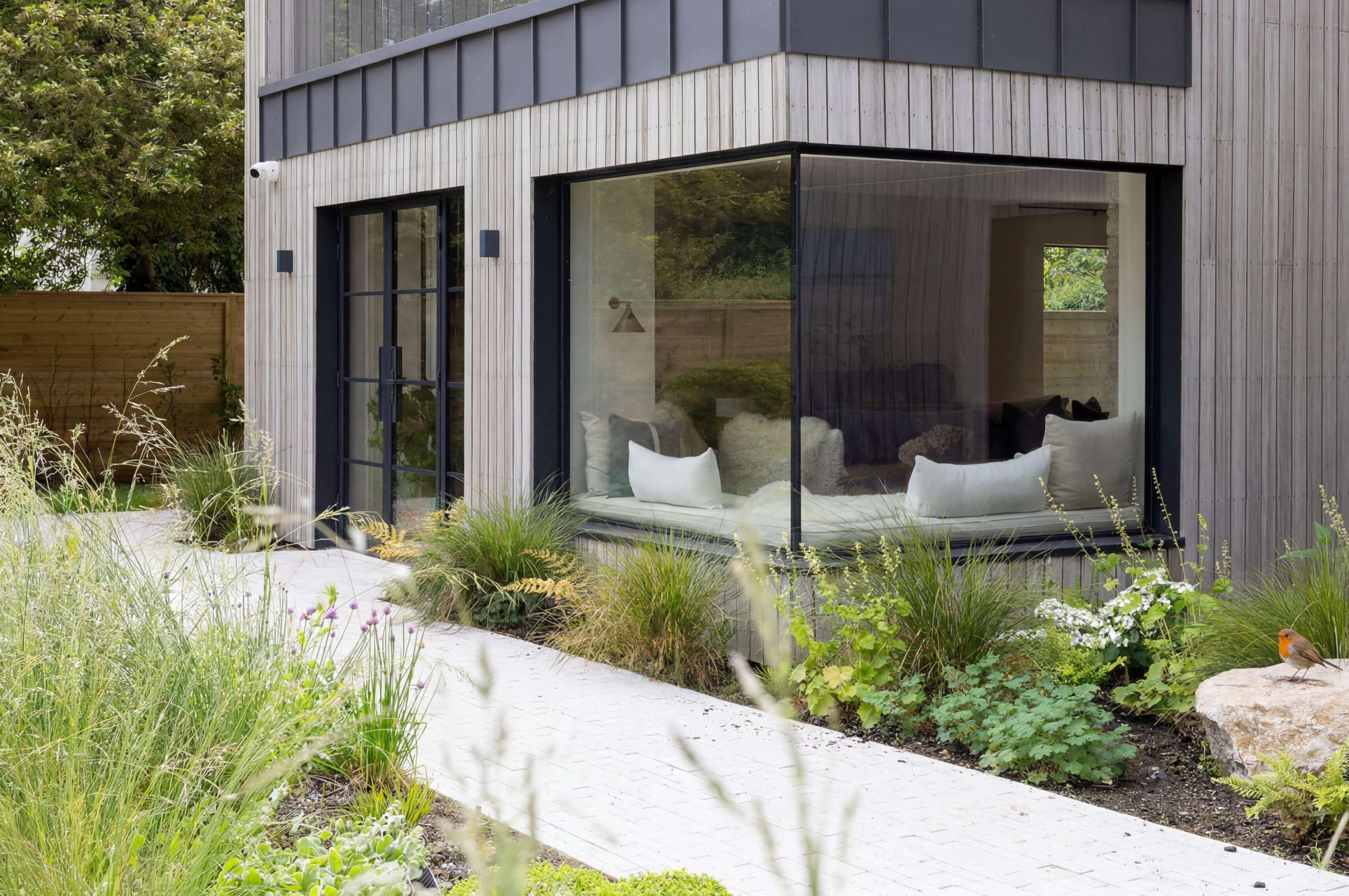 Frameless glass to glass corner window at Orchard House