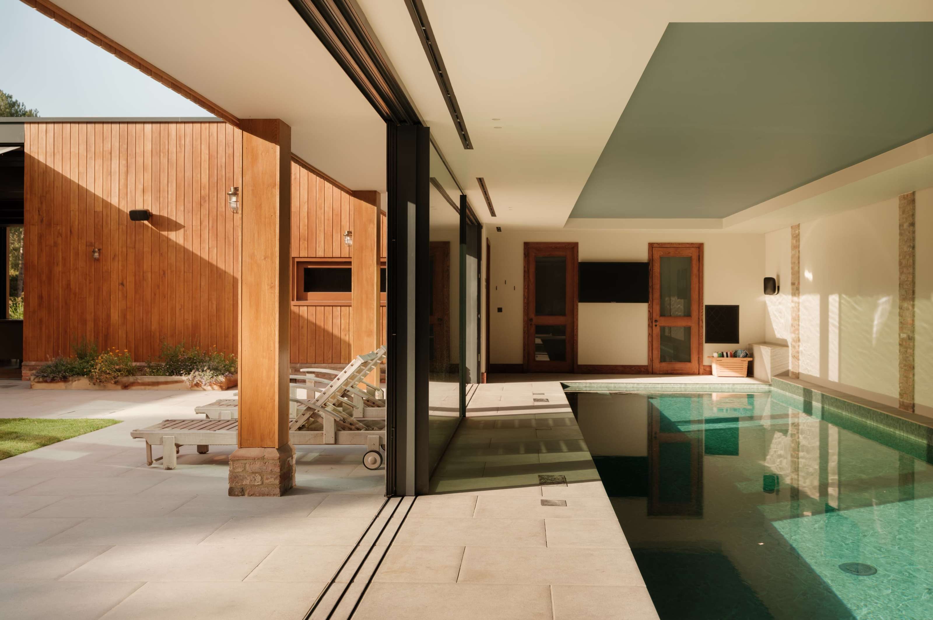 External pocket sliding doors at Foxglove, a SIPs home in Buckinghamshire: triple-glazed panels