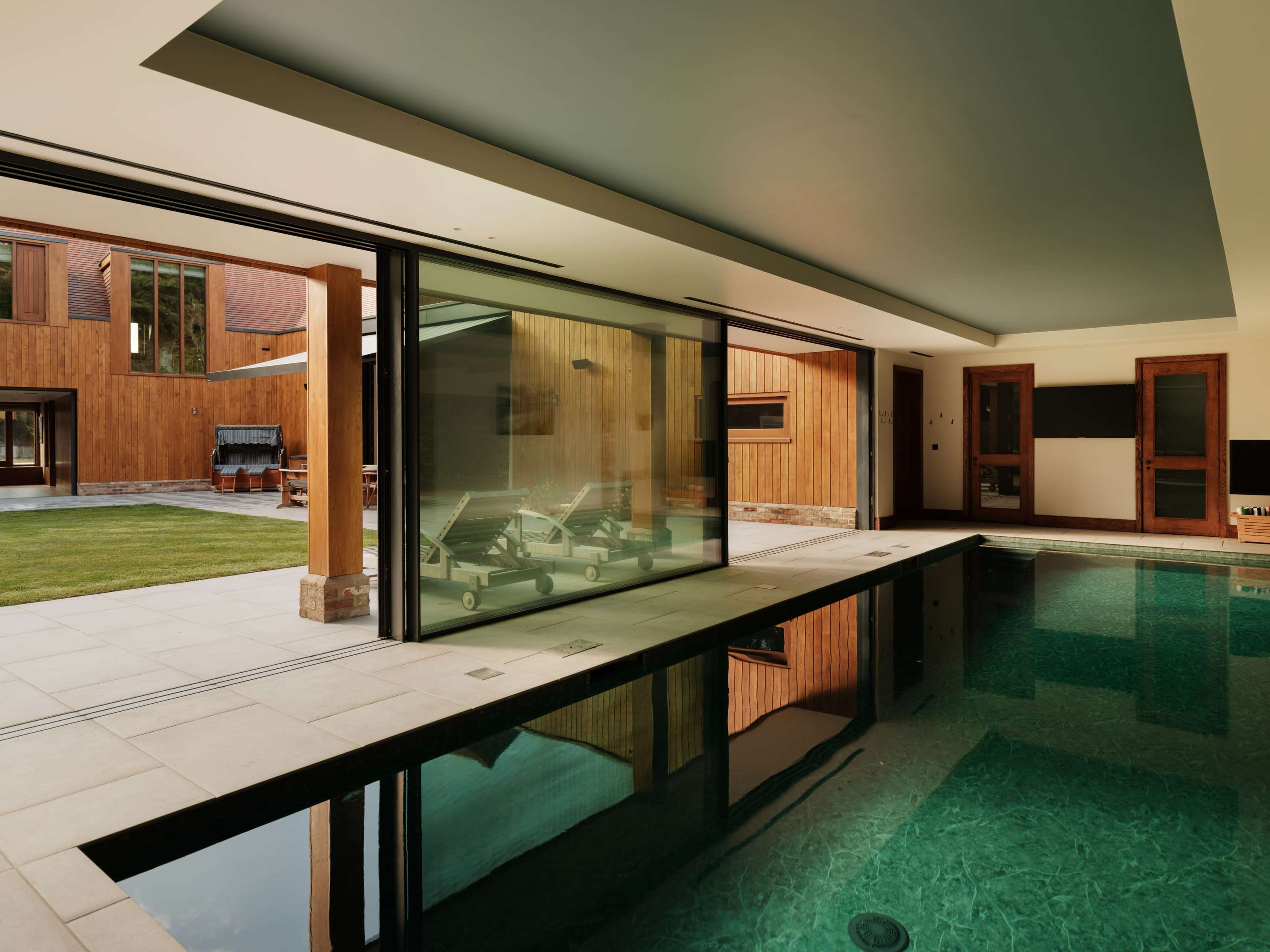 External pocket sliding doors at Foxglove, a SIPs home in Buckinghamshire: triple-glazed panels
