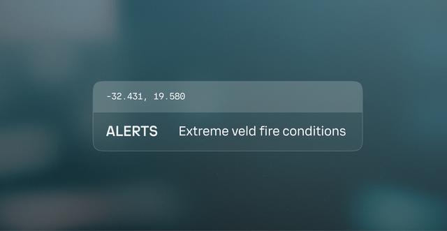 Alert notification on a digital screen showing a location's coordinates and a warning: "Extreme veld fire conditions."