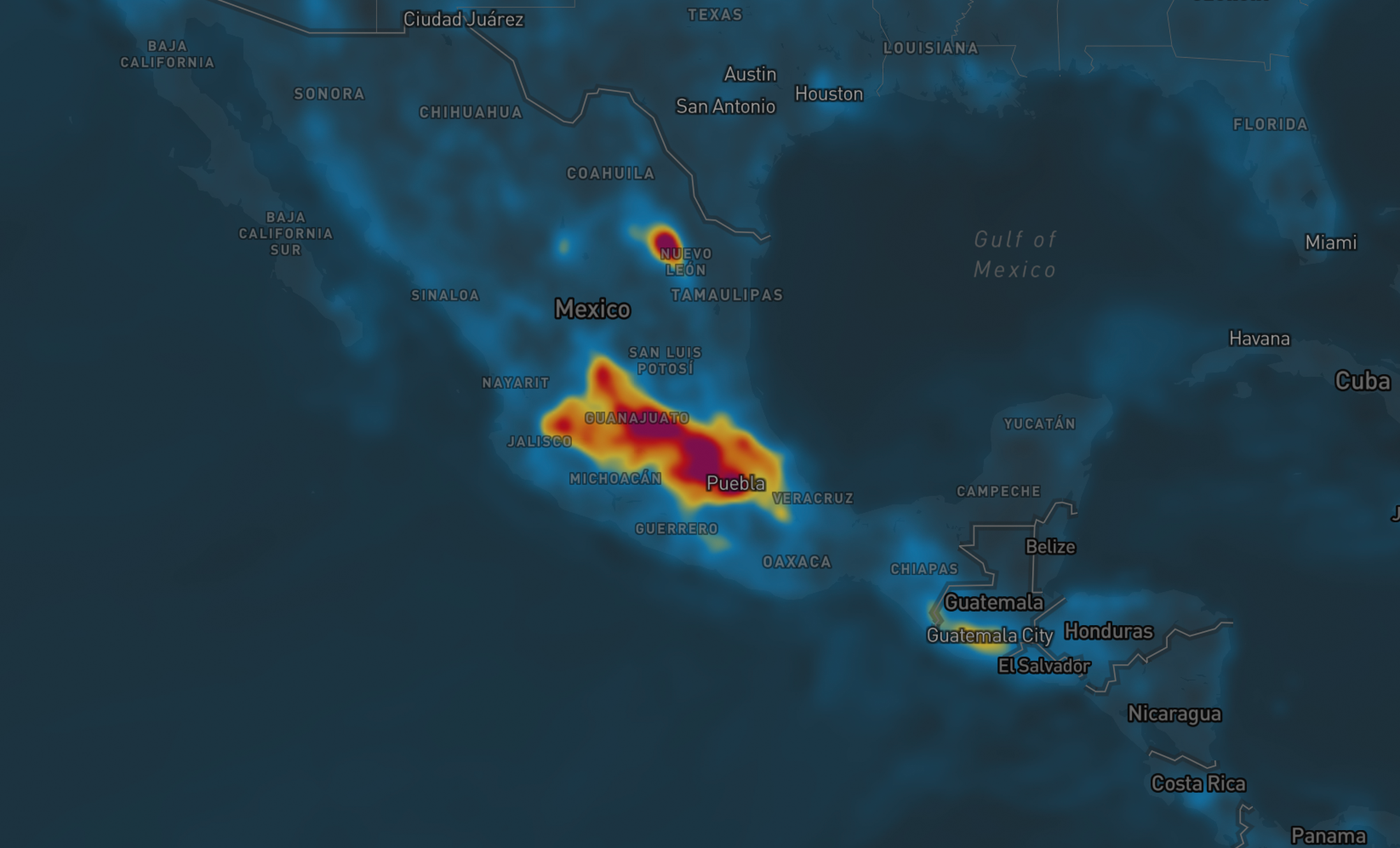 Air quality map showing high activity areas in central and southern Mexico, with intense red around Puebla, set against a dark background.
