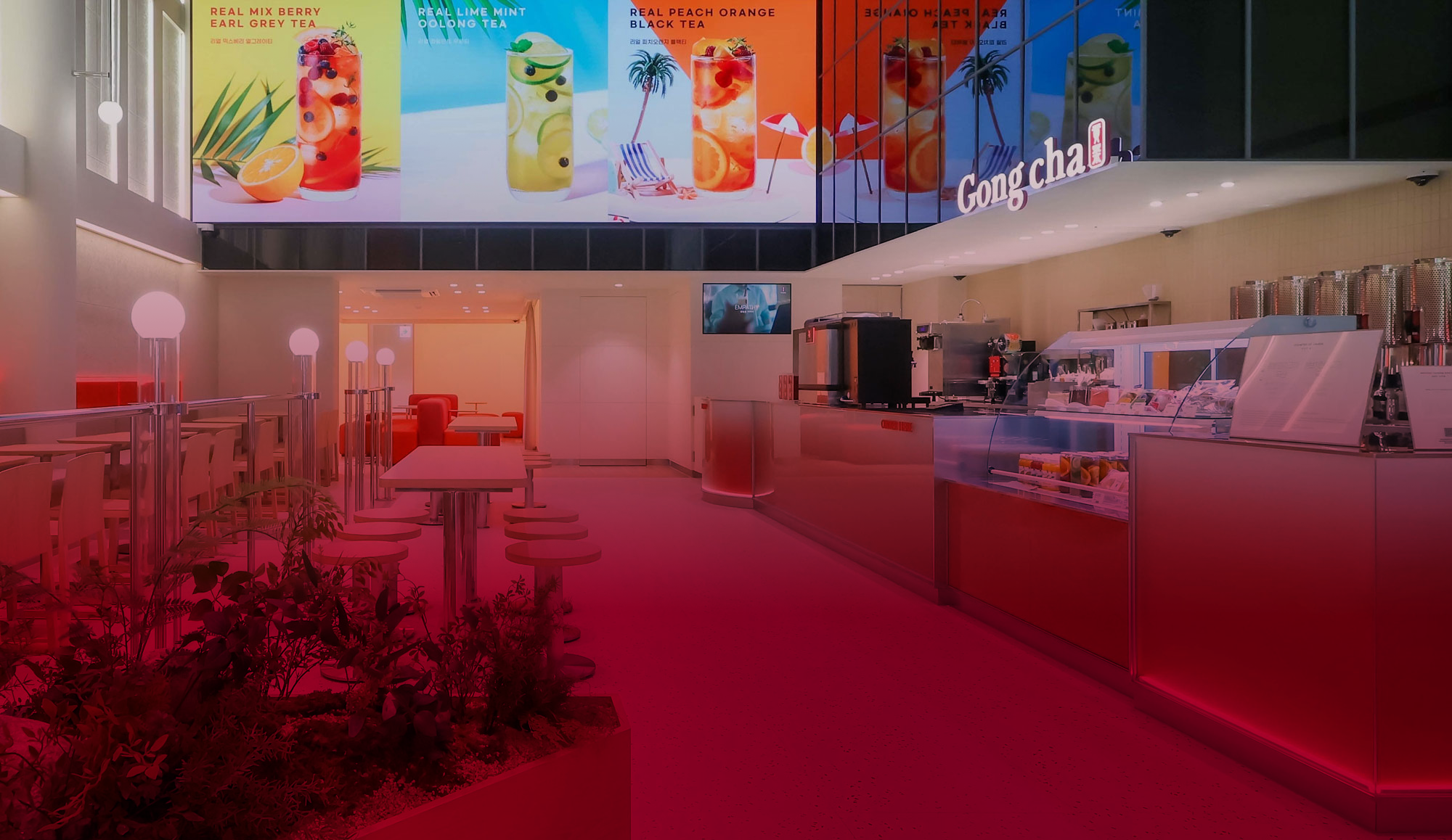 Modern Gong Cha bubble tea shop interior with bright displays of colorful drink options and a sleek, inviting seating area.