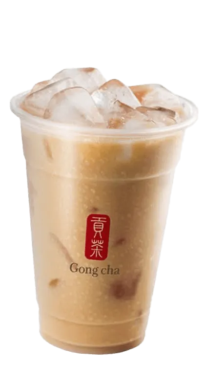 A clear cup of iced bubble tea with milk and ice cubes, adorned with Gong Cha branding.