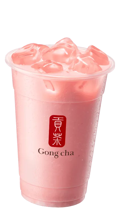 A refreshing strawberry green milk tea with ice, in a clear cup featuring the Gong Cha logo.
