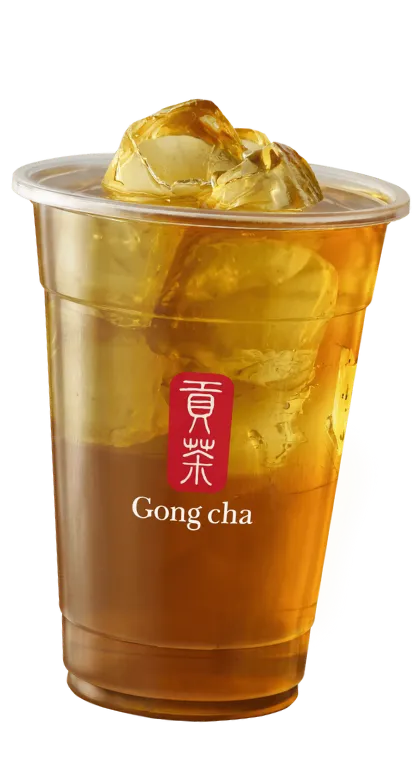 A clear plastic cup filled with iced black tea, featuring the Gong Cha logo.