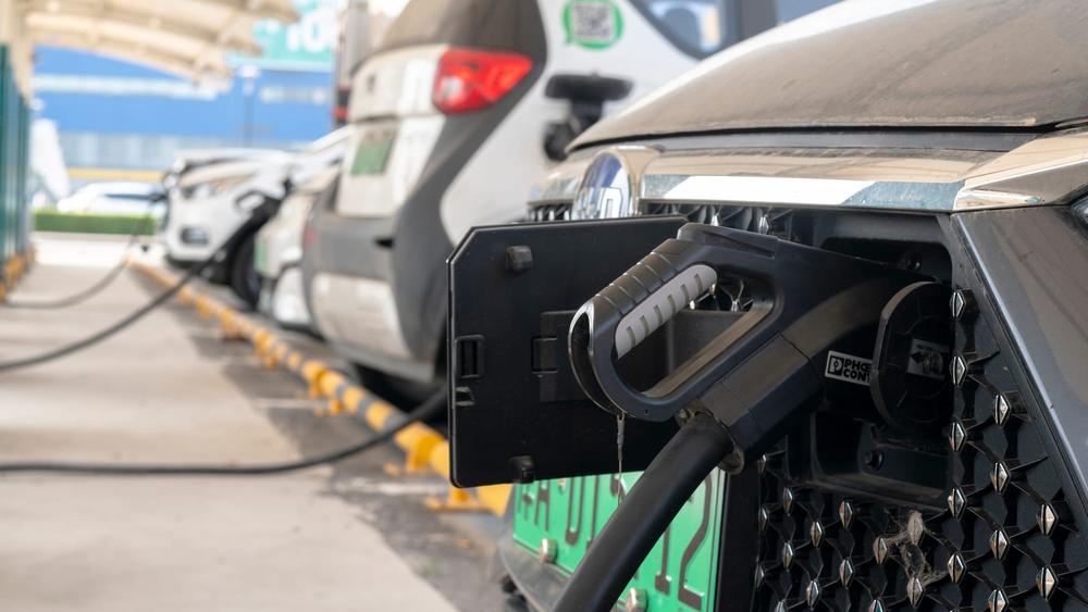 Cars being charged up at a Chinese EV charging station
