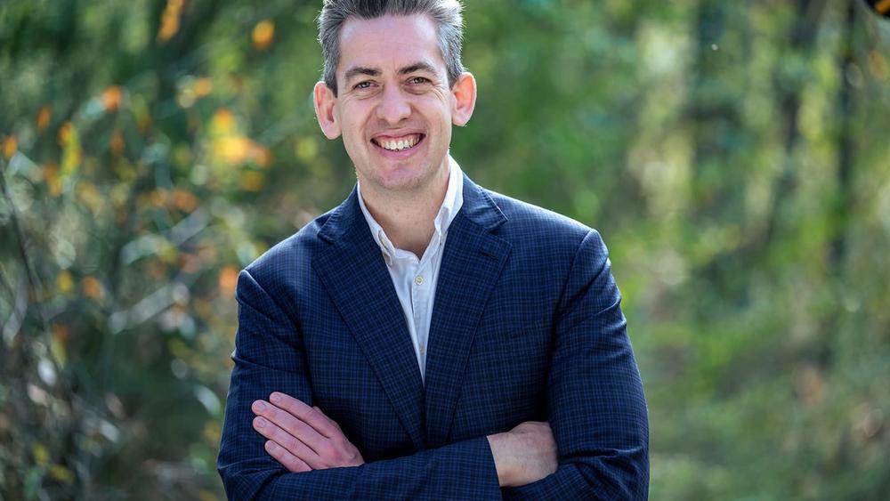 Photograph of Tim Johnston standing outside.