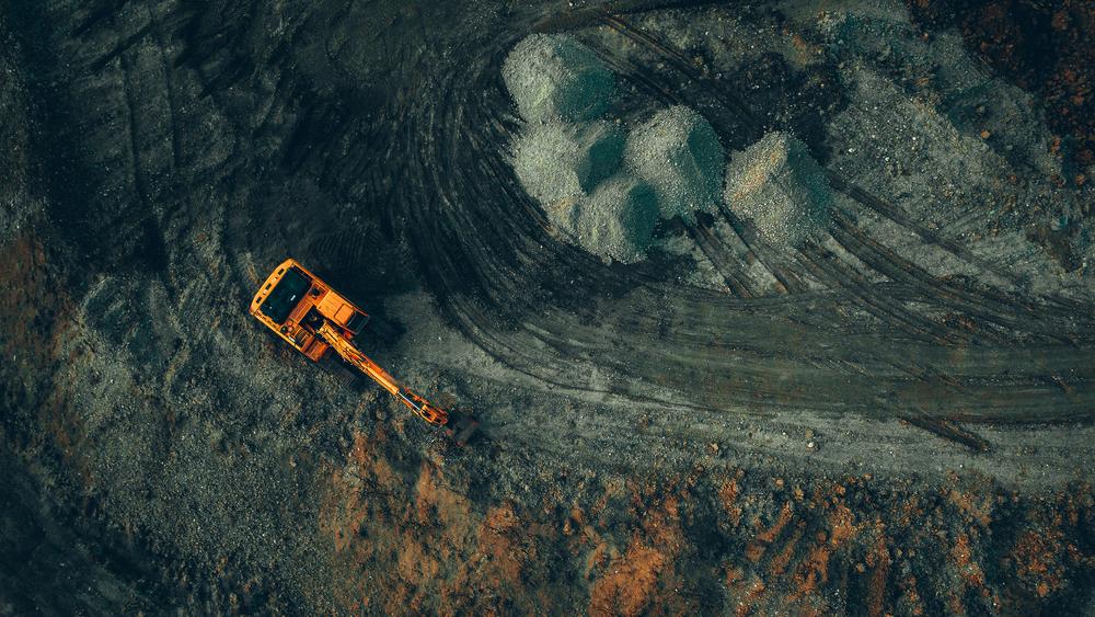Birds-eye view of an excavator working on a mine