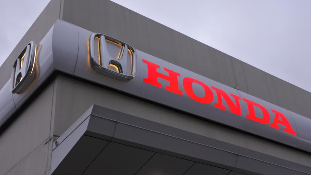 Honda sign on the front of a dealership