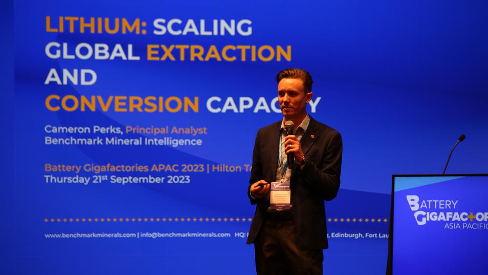 Cameron Perks, principal analyst at Benchmark, giving a presentation.