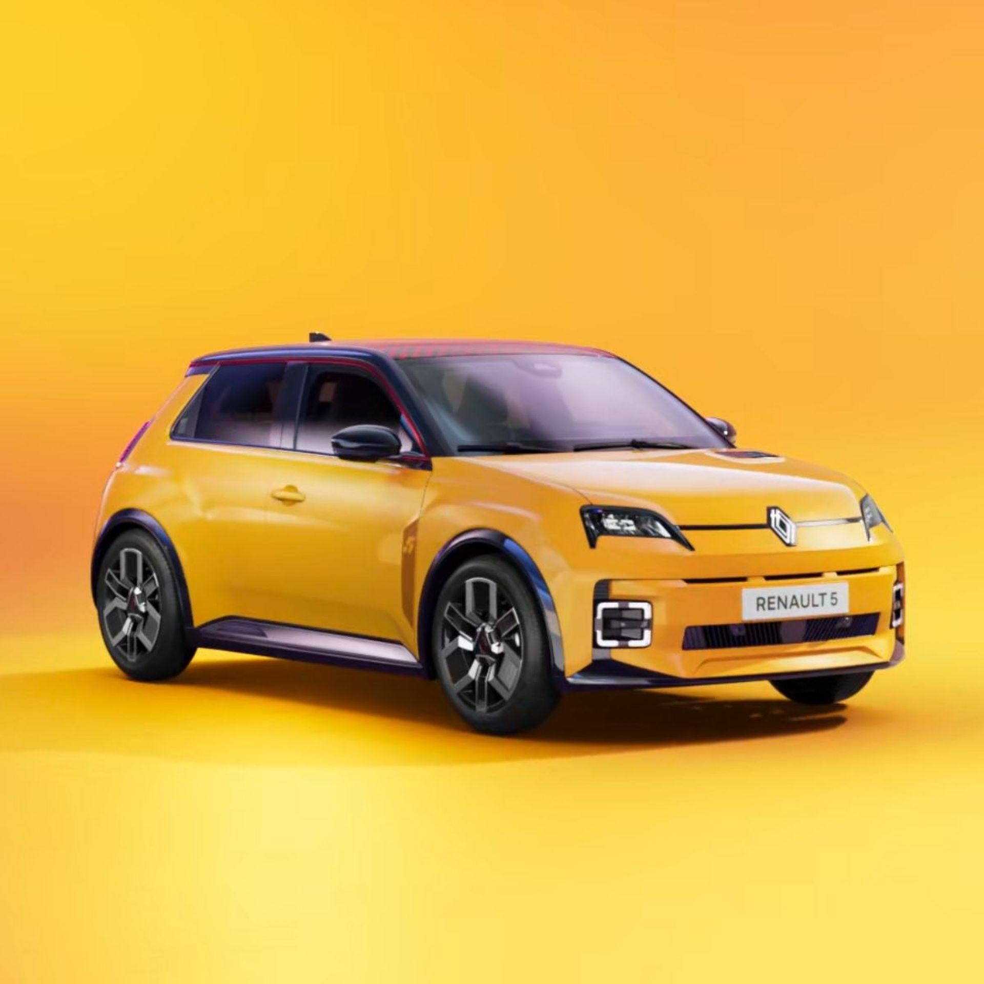 Gelbes Auto der Marke Renault auf orangenem Hintergrund.