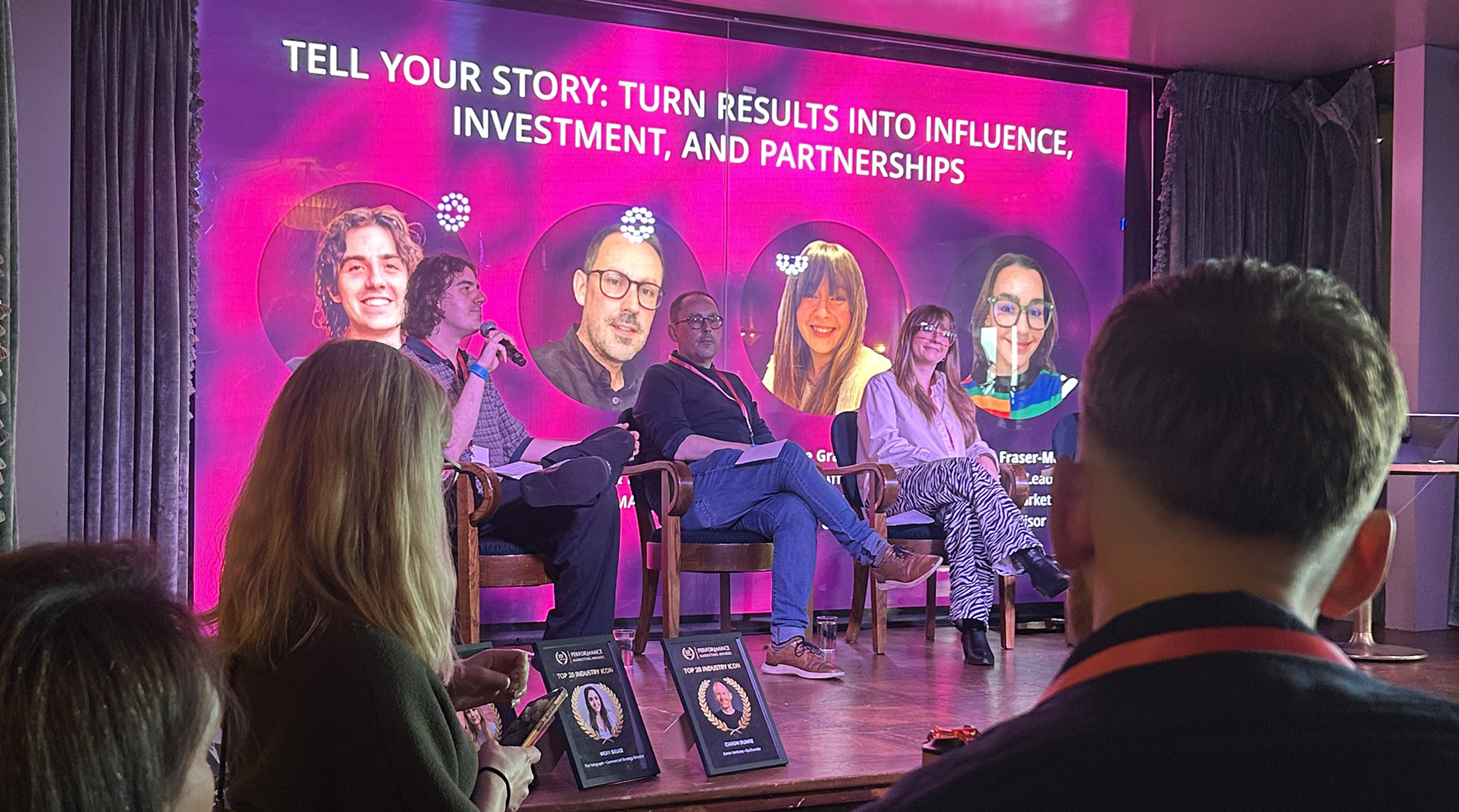 Speakers on stage at the PMAs Finalists' Brunch, the theme of the talk is "Tell Your Story: Turn Results Into Influence, Investment, and Partnerships"