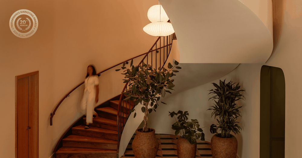 A woman walking down the stairs in the Eades
