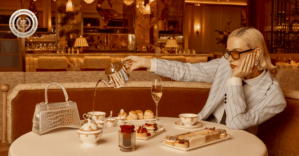 A woman pouring tea in the Savoy