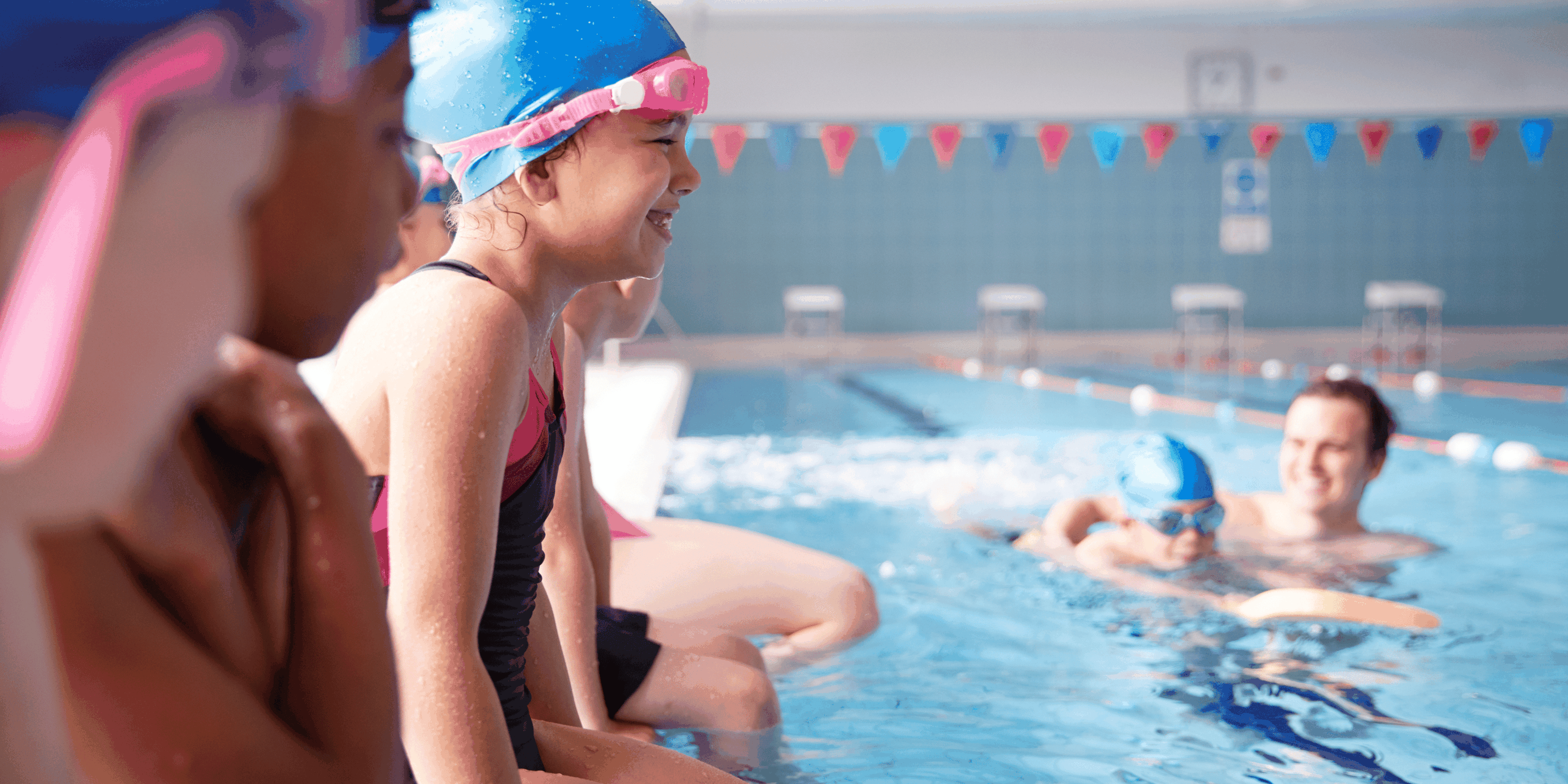 Smiling children sitting by a pool placeholder