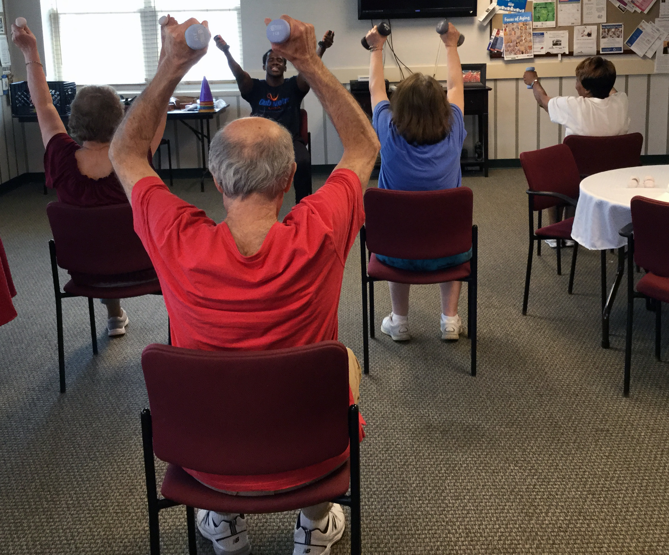 Residents exercising in chairs