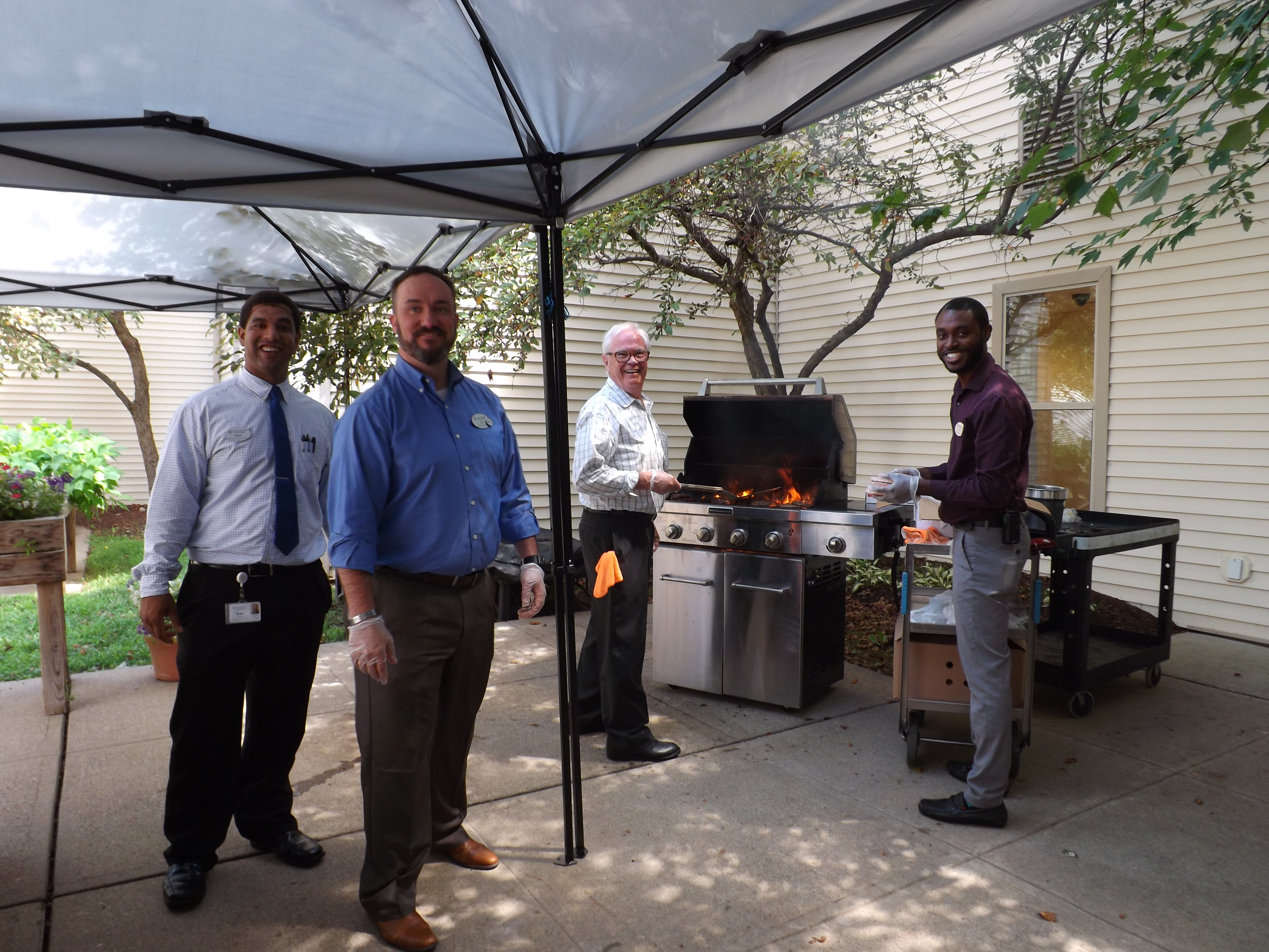 Jeff (third from right) helps at the barbecue grill during Bristol Glen’s Burgers with the Boss event in August 2018. Fellow associates, Miles Scott, dining services director (leftmost); executive director, Jeff Lisk (second from left); and Trevon Wilson, assistant building services director (rightmost); take turns cooking.