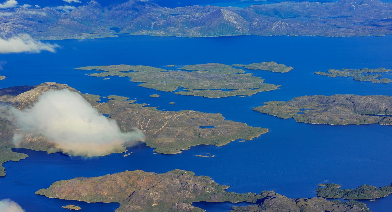 Aerial view of pristine blue lakes and forested islands in Patagonia National Park