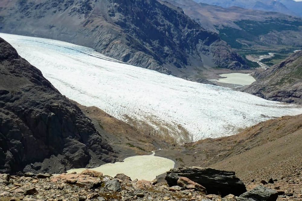 Glacier Viedma and turquoise meltwater lake surrounded by rocky peaks along the Circuito Huemul trail near El Chaltén.