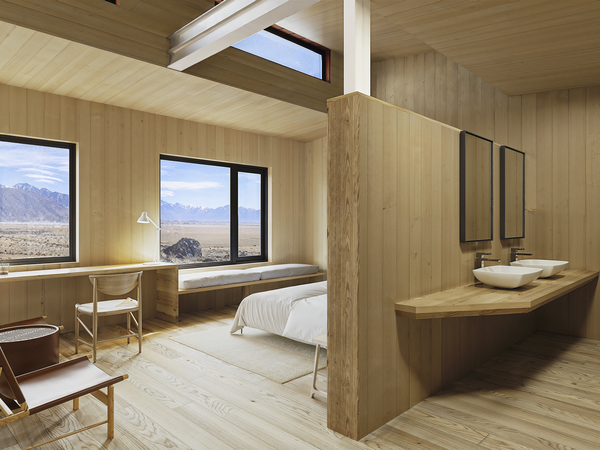Modern luxury lodge bedroom with wooden interiors overlooking Patagonian mountain landscape and valley views.