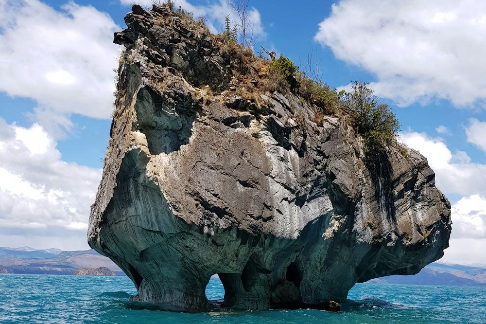 Marble Rock formation rises from turquoise waters in Puerto Tranquilo along the Carretera Austral, Patagonia.