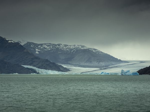 Glacial lake with icebergs and snow-capped mountains at Estancia Cristina, Patagonia.