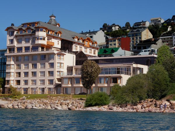 Cacique Inacayal hotel with elegant architecture on the shores of Lake Nahuel Huapi in Bariloche, Argentina.