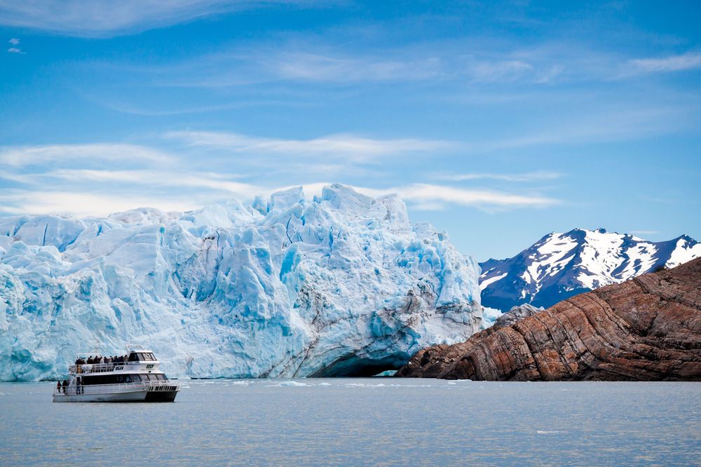 Tourist boat navigating Lago Argentino near Glaciar Perito Moreno in El Calafate, Patagonia.
