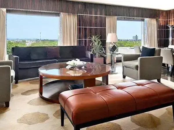 Luxury hotel suite at Park Hyatt with panoramic city views, modern furnishings, and contemporary décor overlooking the skyline.