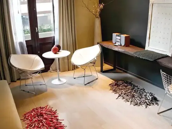 Modern hotel suite in Esplendor with minimalist décor, contemporary furniture, and panoramic windows overlooking the cityscape.