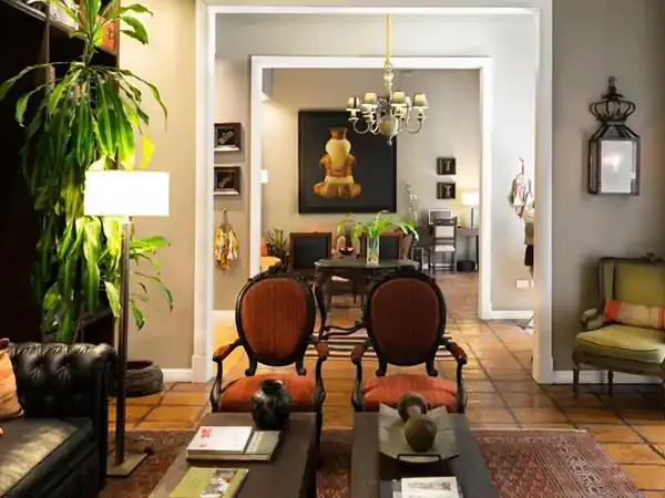 Elegant Buenos Aires colonial-style interior featuring terracotta floors, vintage furnishings, and curated decor reflecting Argentine design heritage.