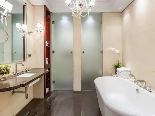 Luxurious modern bathroom at Park Hyatt with freestanding tub, dual vanity, and contemporary fixtures.