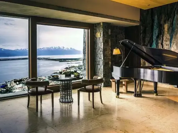 Grand piano overlooking Beagle Channel and Andes mountains in luxury Arakur hotel, Ushuaia, Patagonia.