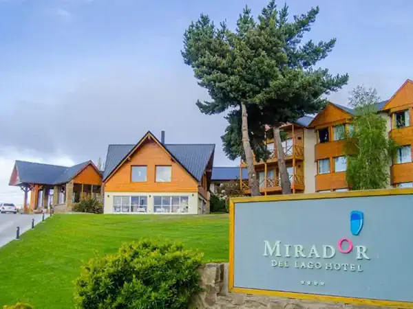 Mirador del Lago Hotel entrance with colorful architecture and manicured grounds in Patagonia.