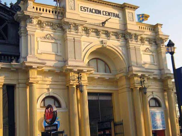 Historic yellow neoclassical Estación Central railway station in Santiago, Chile's downtown district.