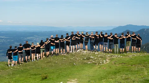 Teambild des gemeinsamen Ausflugs auf die Kampenwand
