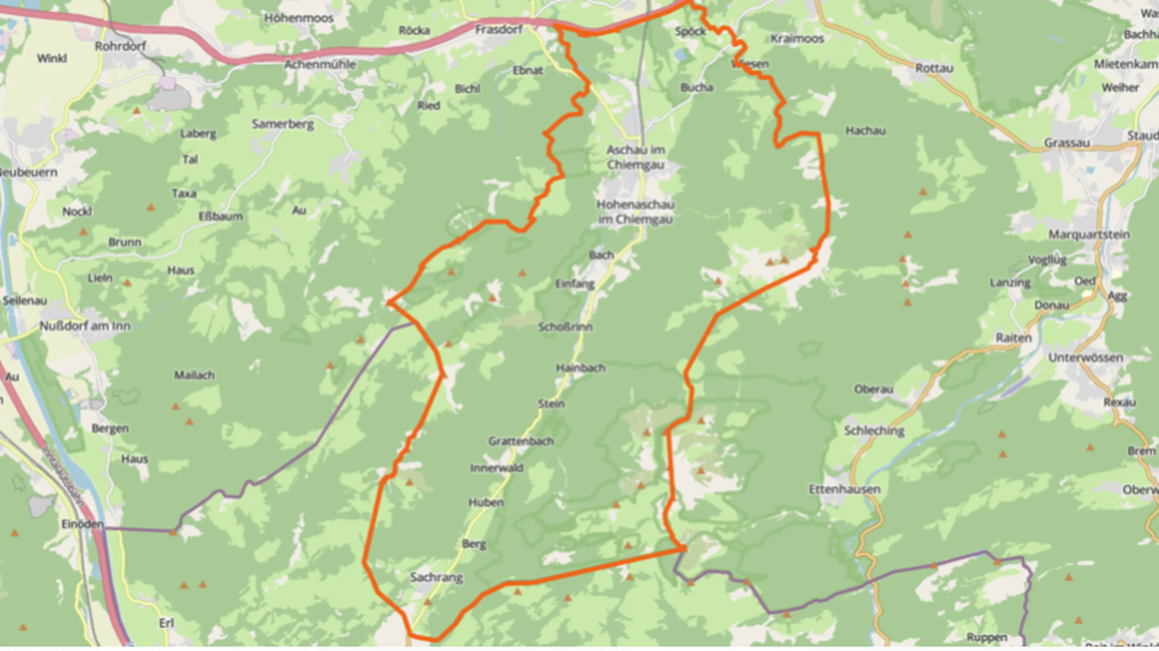 Map showing a hiking route outlined in orange through a mountainous region with various towns and natural landmarks labeled.