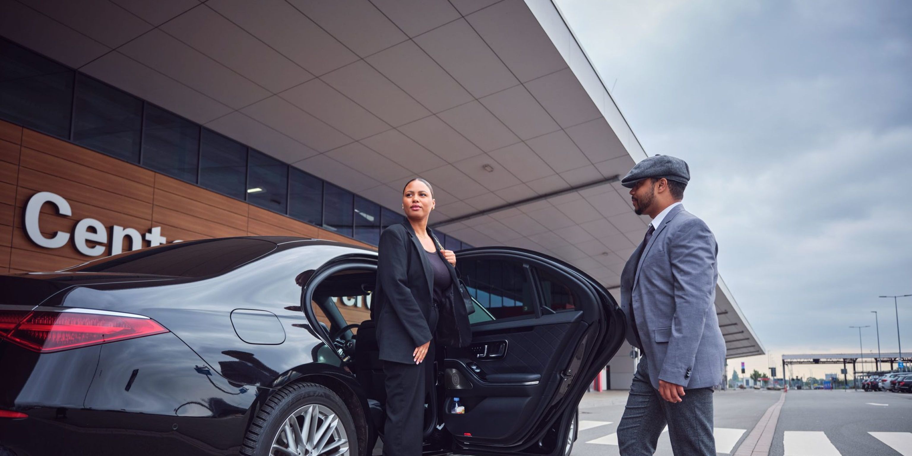 agt limousine driver opens the door