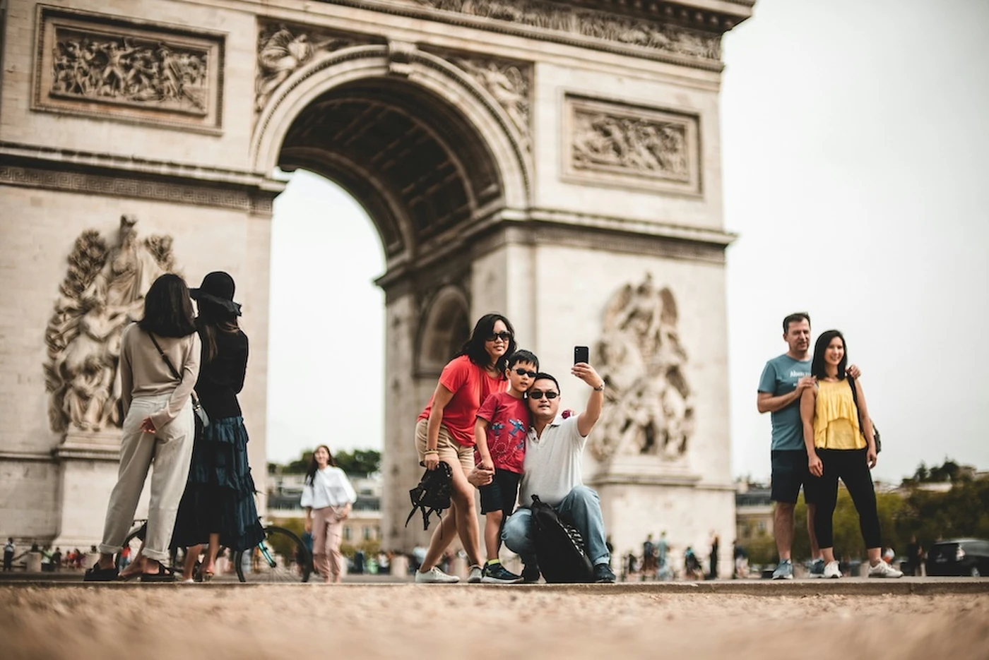 tourists taking pictures in front of a landmark
