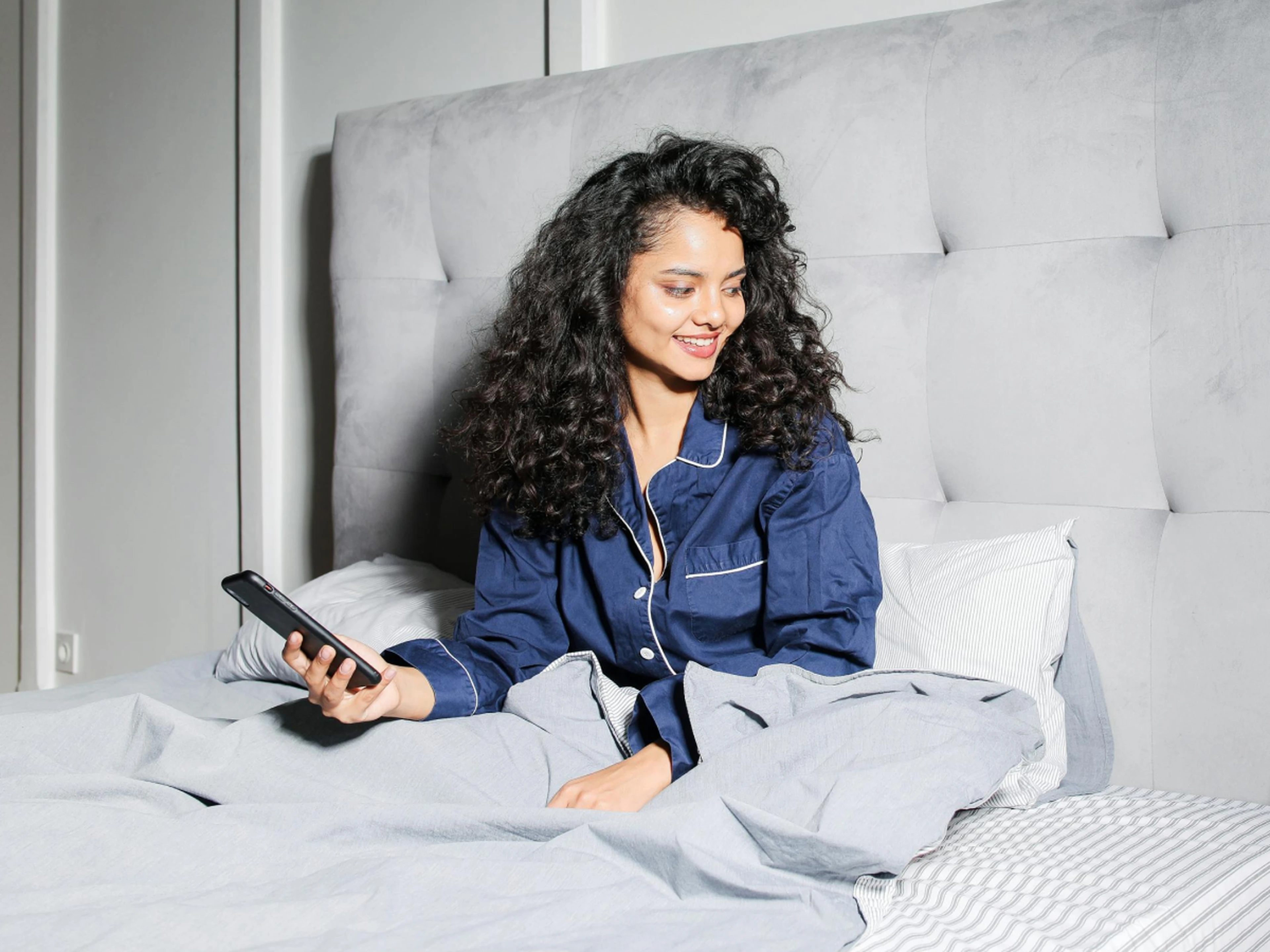 hotel guest receiving email on smartphone