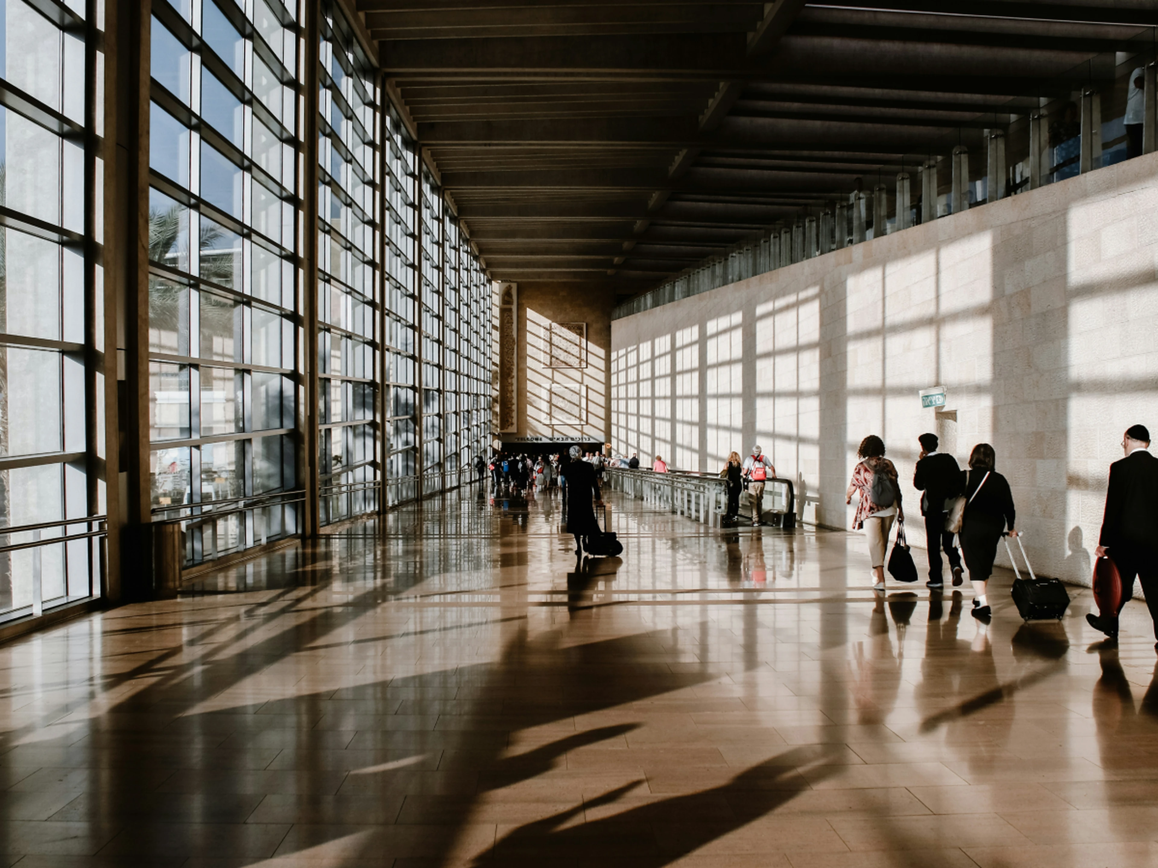 Airport hall with people in it