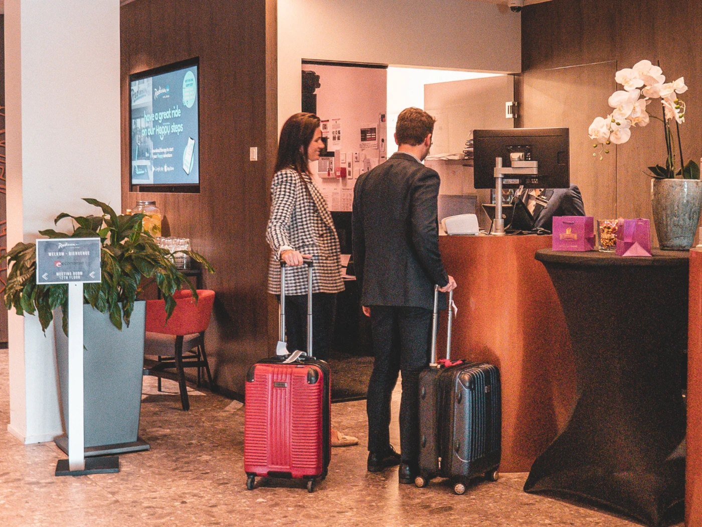 People checking in to a hotel
