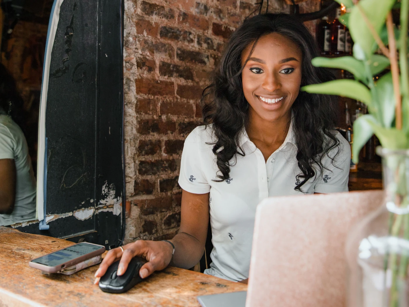 hotelier using a laptop at the front desk