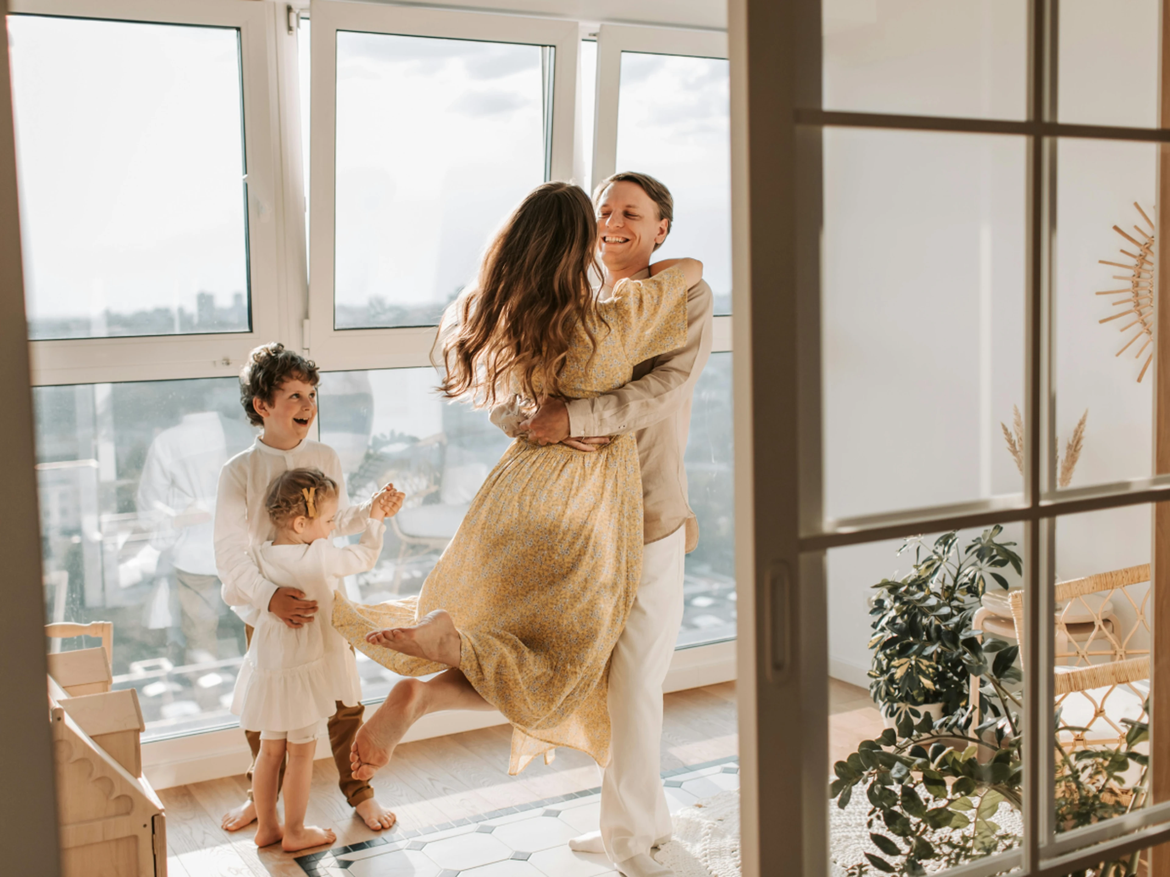 family with two young kids in their hotel room