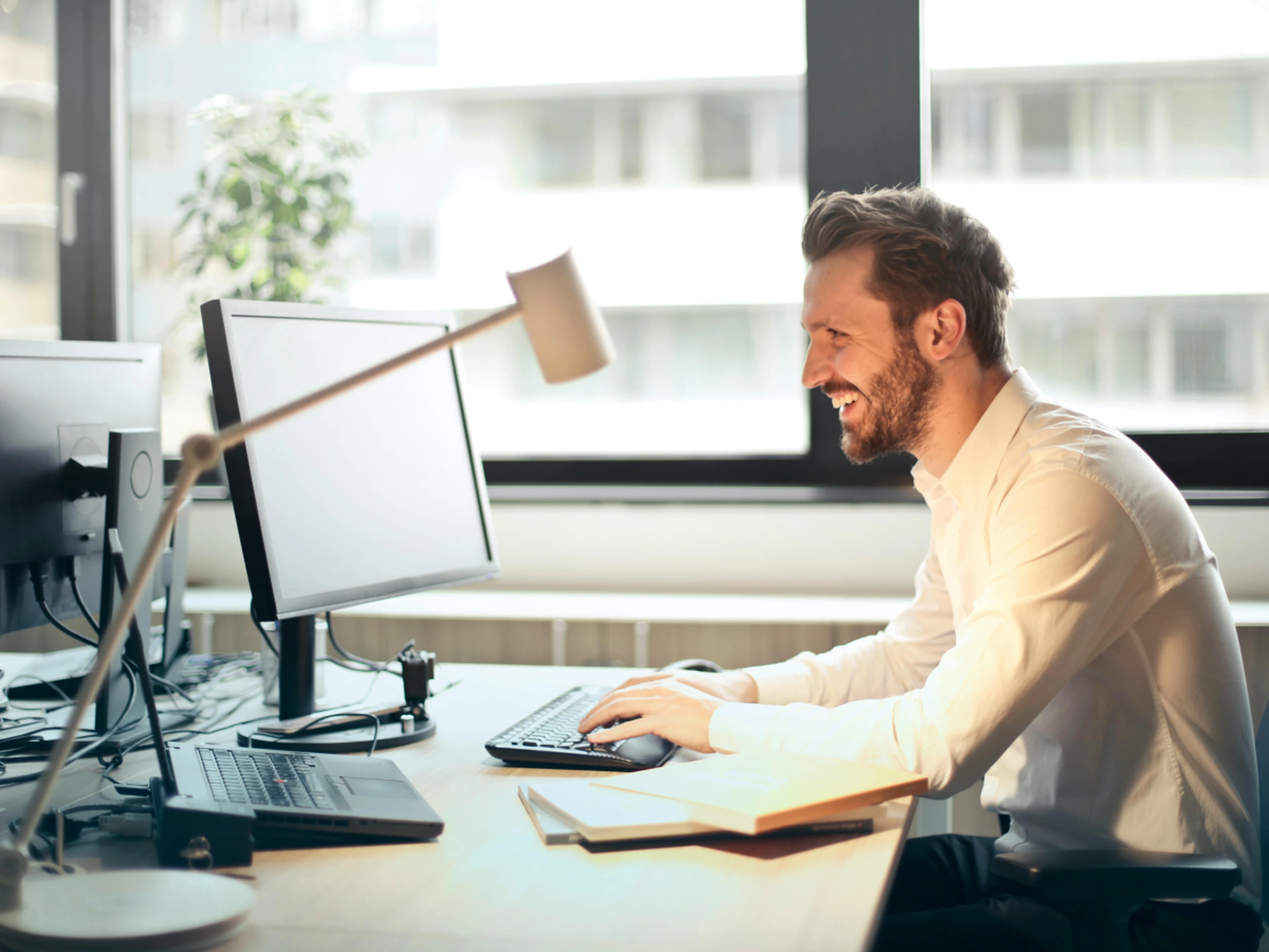 Man at desk looking at computer