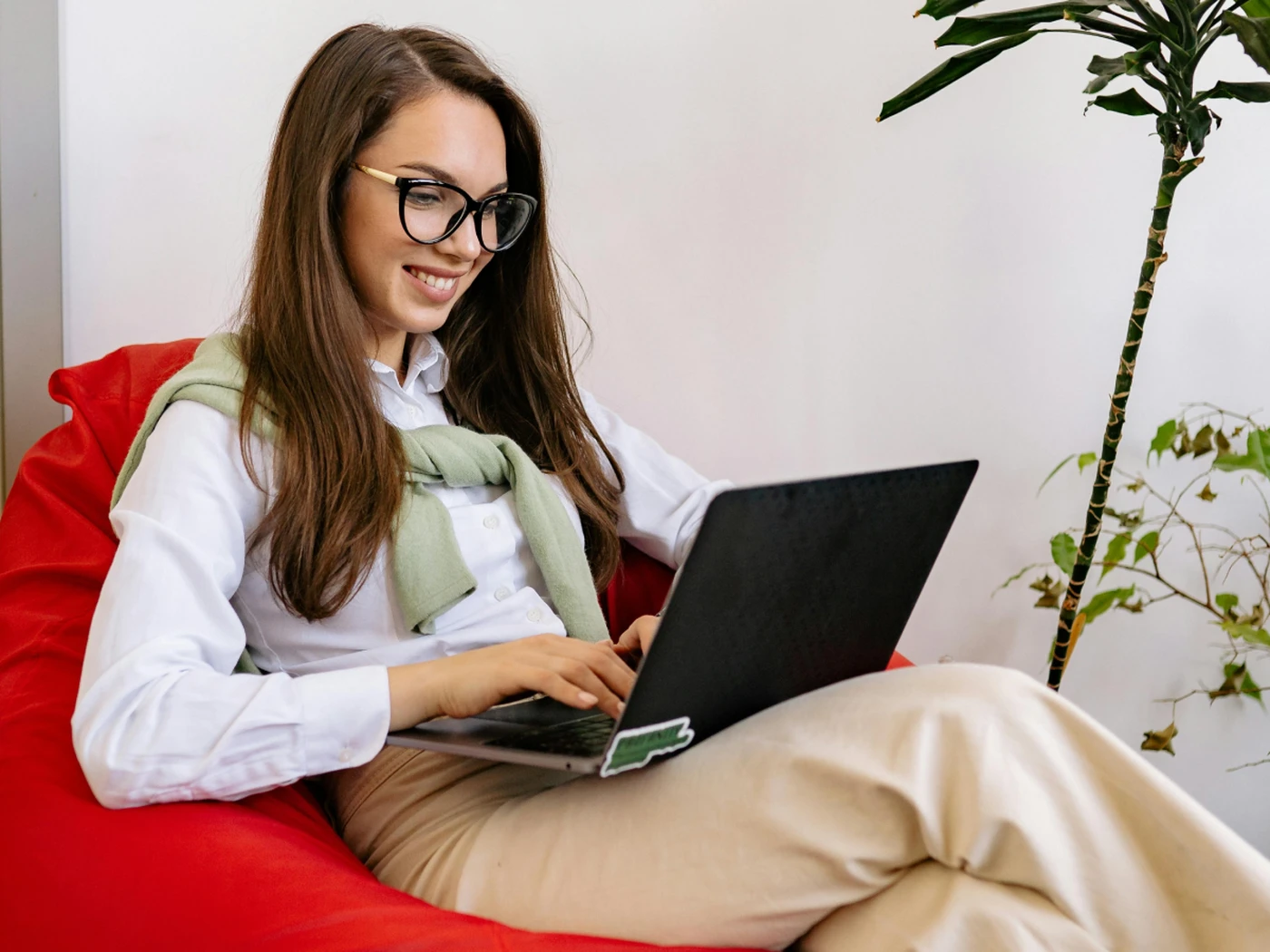 Independent hotelier using a laptop in a relaxed way